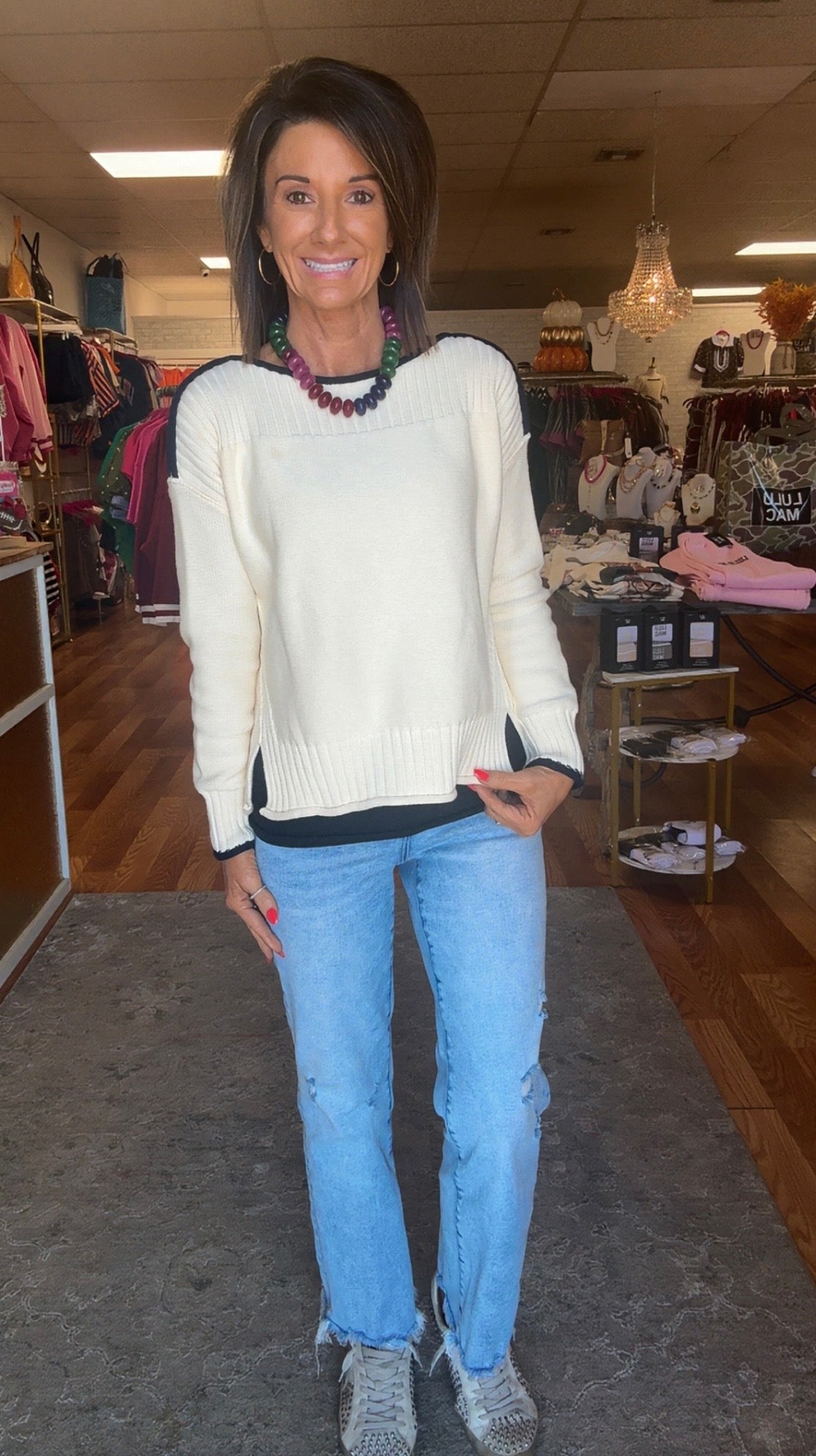 Cream sweater/ navy trim