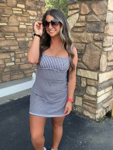 Trendy and functional gingham print dress.