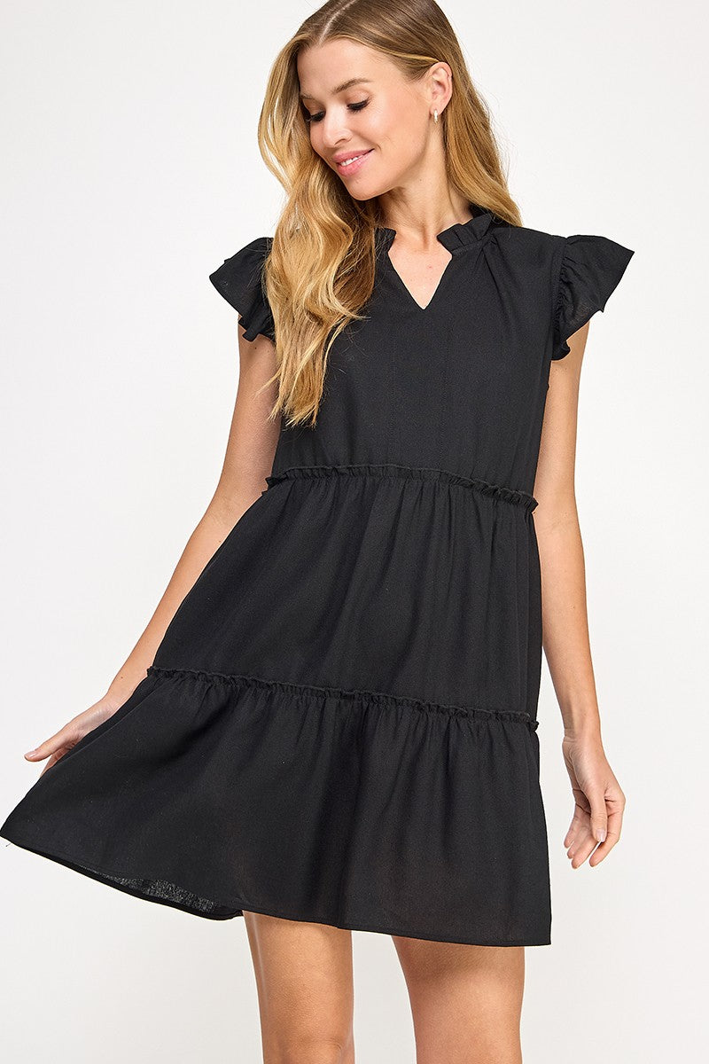Black Linen dress
Ruffled neckline detail
Ruffle cap sleeve
V slash neckline
Mini ruffle detail along each tier
Side pockets