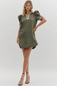 Solid pleated short puff sleeve mini dress featuring animal pattern contrast detail. Side Pockets. Lined. Woven. Non-sheer. Lightweight.