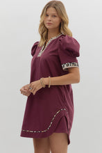 Solid pleated short puff sleeve mini dress featuring animal pattern contrast detail. Side Pockets. Lined. Woven. Non-sheer. Lightweight.