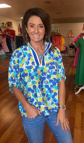Blue Abstract print elasticated sleeve dolman top featuring multicolor accented split neck with high neck band. Unlined.