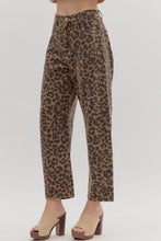 Leopard pattern ankle-length pants. Button fly-front zipper closure. Pockets at sides and back patch pockets. Unlined. Woven. Non-sheer. Lightweight.