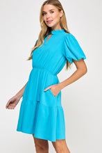 Solid tiered dress
Ruffled neckline
V neck placket
Puff short bubble sleeve
Pockets