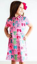 Pink twirl and bows polo dress