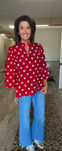 Red top. White polka dots v-neck Ruffled Neckline Polka Dot top