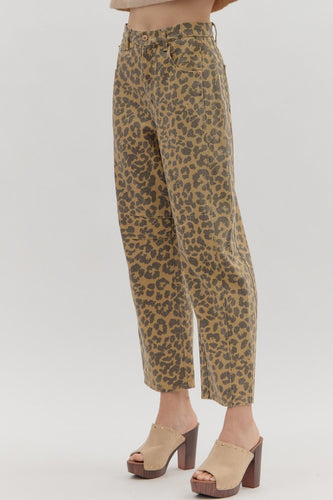 Leopard pattern ankle-length pants. Button fly-front zipper closure. Pockets at sides and back patch pockets. Unlined. Woven. Non-sheer. Lightweight.