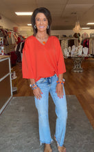 Orange v-neck top 3/4 sleeve. Super soft. Great fit