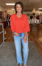 Orange v-neck top 3/4 sleeve. Super soft. Great fit