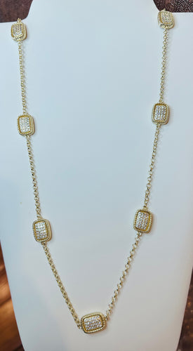 A beautiful long gold necklace. Bling.
