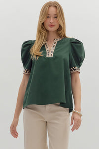 Hunter green Solid pleated short voluminous sleeve pullover top featuring accent V-neck band. Unlined. Woven. Semi-sheer. LIghtweight.