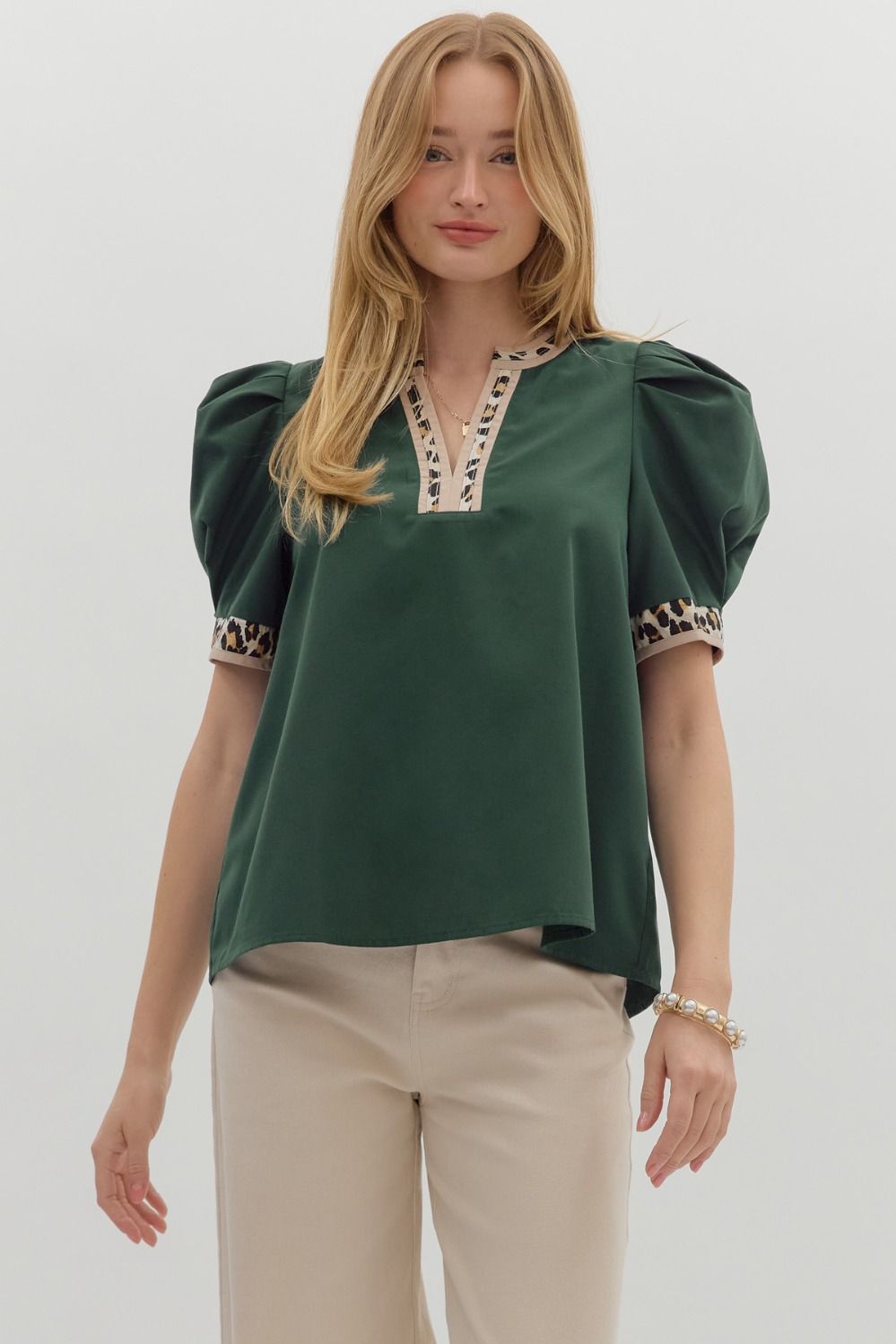 Hunter green Solid pleated short voluminous sleeve pullover top featuring accent V-neck band. Unlined. Woven. Semi-sheer. LIghtweight.