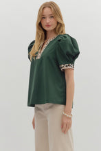Hunter green Solid pleated short voluminous sleeve pullover top featuring accent V-neck band. Unlined. Woven. Semi-sheer. LIghtweight.