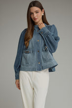 Denim Solid long puff sleeve  with button closure at front. Front patch pockets with metal hardware detail. Button cuffs. Medium weight. Jacket