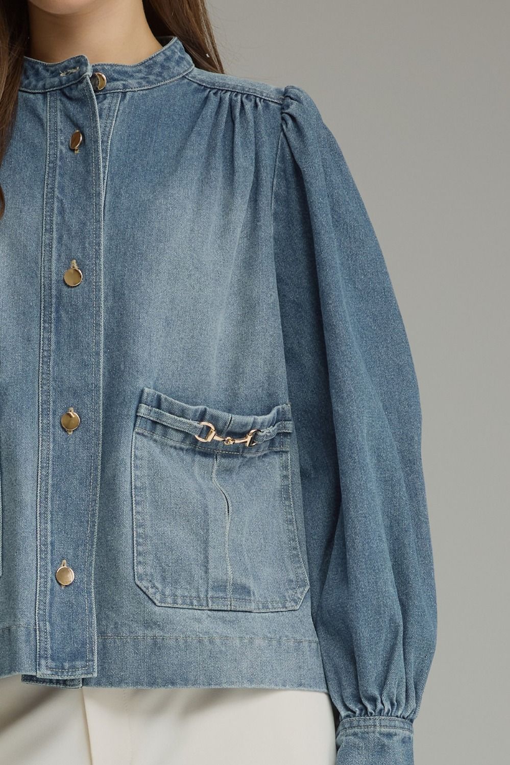 Denim jacket! Solid long puff sleeve  with button closure at front. Front patch pockets with metal hardware detail. Button cuffs. Medium weight. Jacket