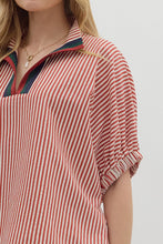 Stripe pattern high neck elasticated sleeve band dolman top featuring accented multicolor rib band split neck. Unlined. Woven. Non-sheer. Lightweight.