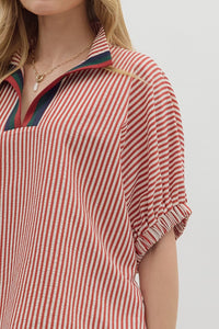 Stripe pattern high neck elasticated sleeve band dolman top featuring accented multicolor rib band split neck. Unlined. Woven. Non-sheer. Lightweight.
