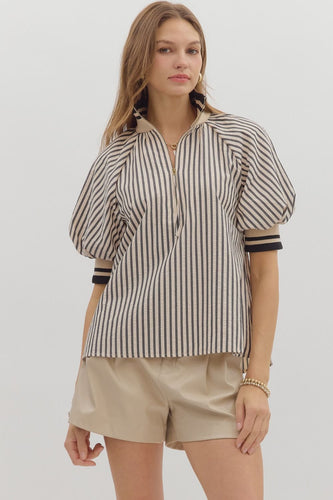 Black Stripe pattern half-zip closure short puff sleeve top featuring multicolor accent band. Unlined. Woven. Non-sheer. Lightweight.