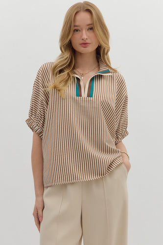 Caramel Stripe pattern high neck elasticated sleeve band dolman top featuring accented multicolor rib band split neck. Unlined. Woven. Non-sheer. Lightweight.