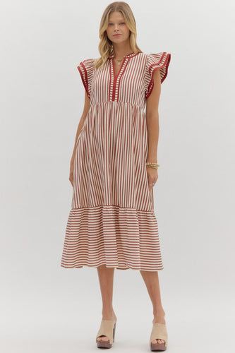 Rust Textured stripe pattern tiered ruffle flutter sleeve featuring contrast accent binding detail. Side pockets. Lined. Woven. Non-sheer. Lightweight.