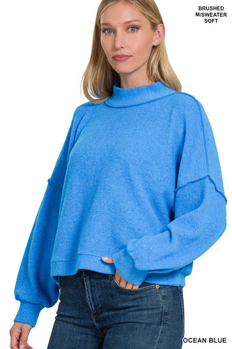 Ocean  blue BRUSHED MELANGE HACCI SWEATER
- EXPOSED SEAMS
- BACH PATCH