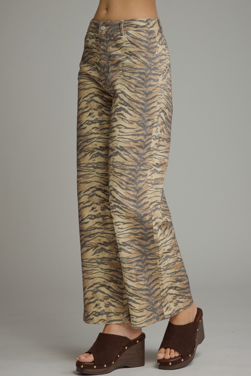 Animal print wide leg pants with front pockets and back pockets.