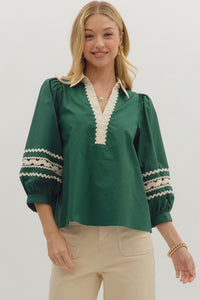 Hunter green Solid 3/4 puff sleeve top featuring contrast collar and scallop trim V-neck with rickrack trim on sleeve panels. Unlined. Woven. Non-sheer. Lightweight.