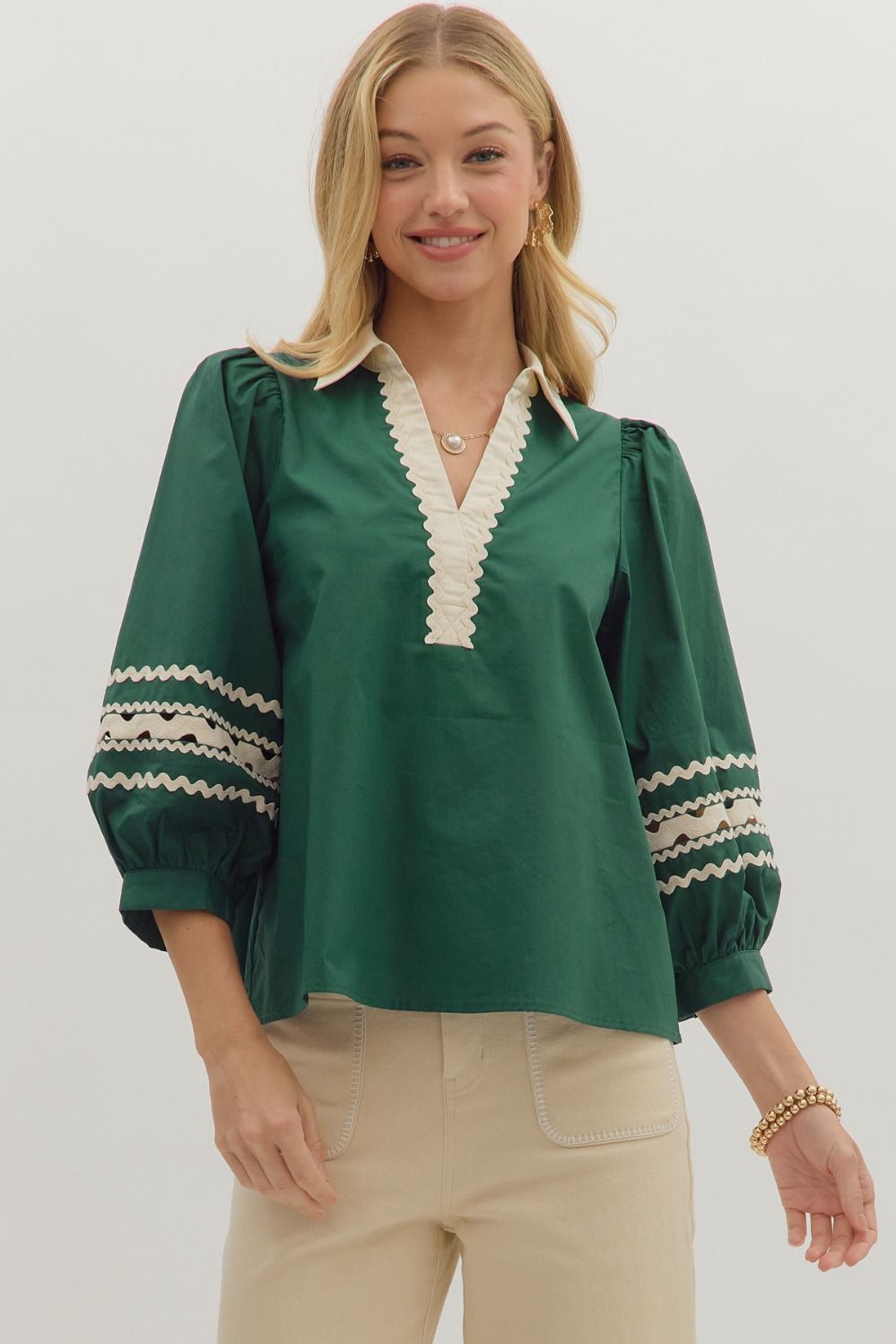 Hunter green Solid 3/4 puff sleeve top featuring contrast collar and scallop trim V-neck with rickrack trim on sleeve panels. Unlined. Woven. Non-sheer. Lightweight.