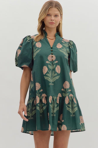 Hunter green Floral short bubble sleeve ruffle hem mini dress featuring ruffle neck band collar gold accent button closure. Side pockets. Lined. Woven. Non-sheer. Lightweight.