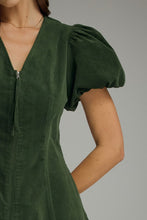 Hunter green Solid V-neck short puff sleeve dress featuring front zipper closure. Elasticated sleeve openings. Side pockets. Unlined. Woven. Non-sheer. Lightweight.