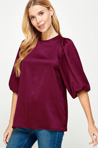 Plum -Solid satin blouse
Dramatic 3/4 puff sleeve
Elastic in wrists
Back button keyhole closure
Satin air flow fabric w/ sheen
No stretch