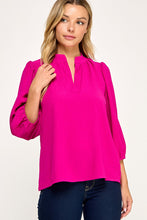 Magenta Solid blouse
Mandarin collar
V neck placket
Shirring along neckline
Shirring along shoulder