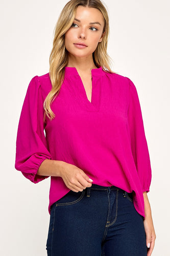 Magenta Solid blouse
Mandarin collar
V neck placket
Shirring along neckline
Shirring along shoulder