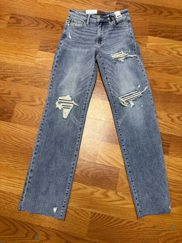 Mid rise Judy blues jeans. Distressing but has jeans behind. No skin shows